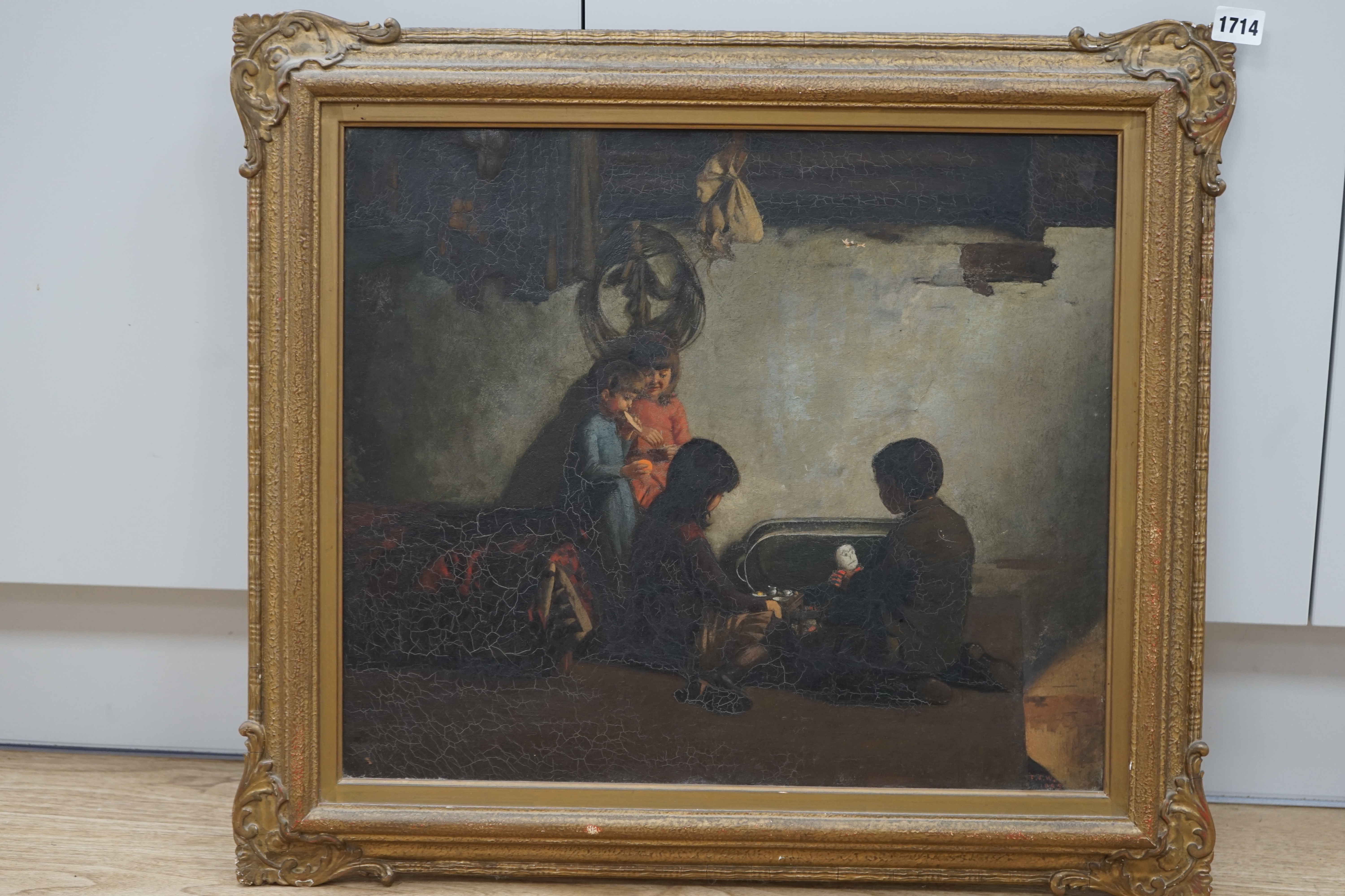 F.J.W., 19th century School, oil on canvas, Four children in an interior, initialled and dated 1885, 42 x 49cm. Condition - poor, dirt and craquelure all over